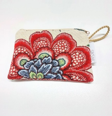 Väike ilma voodrita mustriga gobeläänkangast kosmeetikakott.