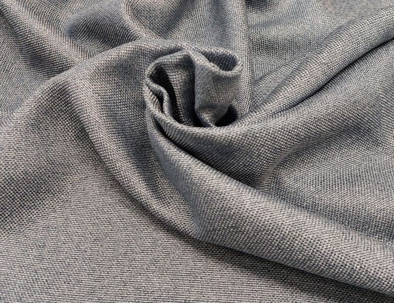 Tumesinine struktuurse pinnaga poolpimendav kardin.