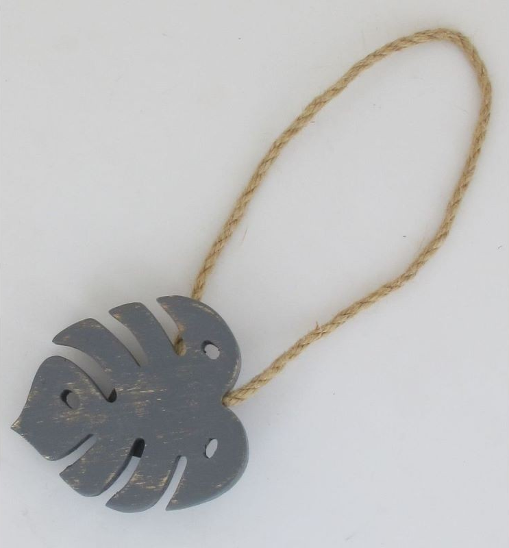 Puidust monstera lehe kujuline kardinamagnet kardinate kokku sättimiseks.